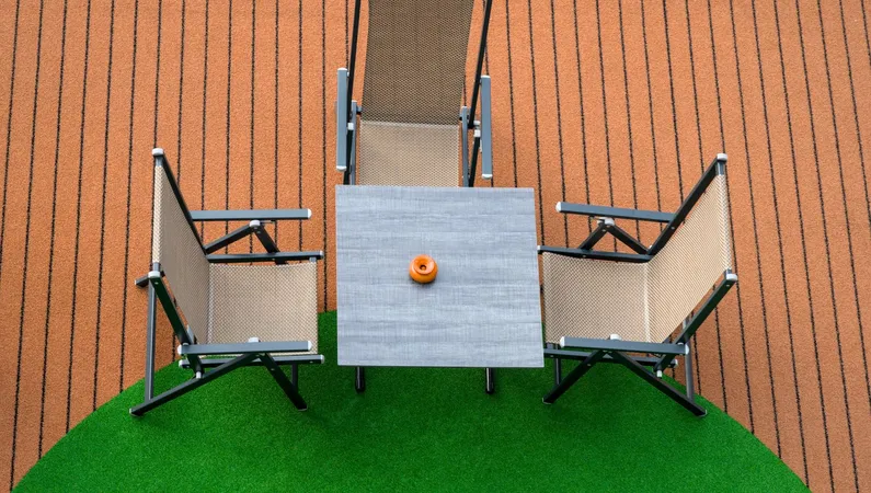 Patio furniture on green artificial turf, seen from above